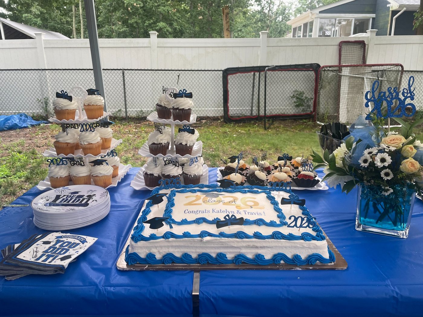 Dessert table with graduation cake and cupcakes
