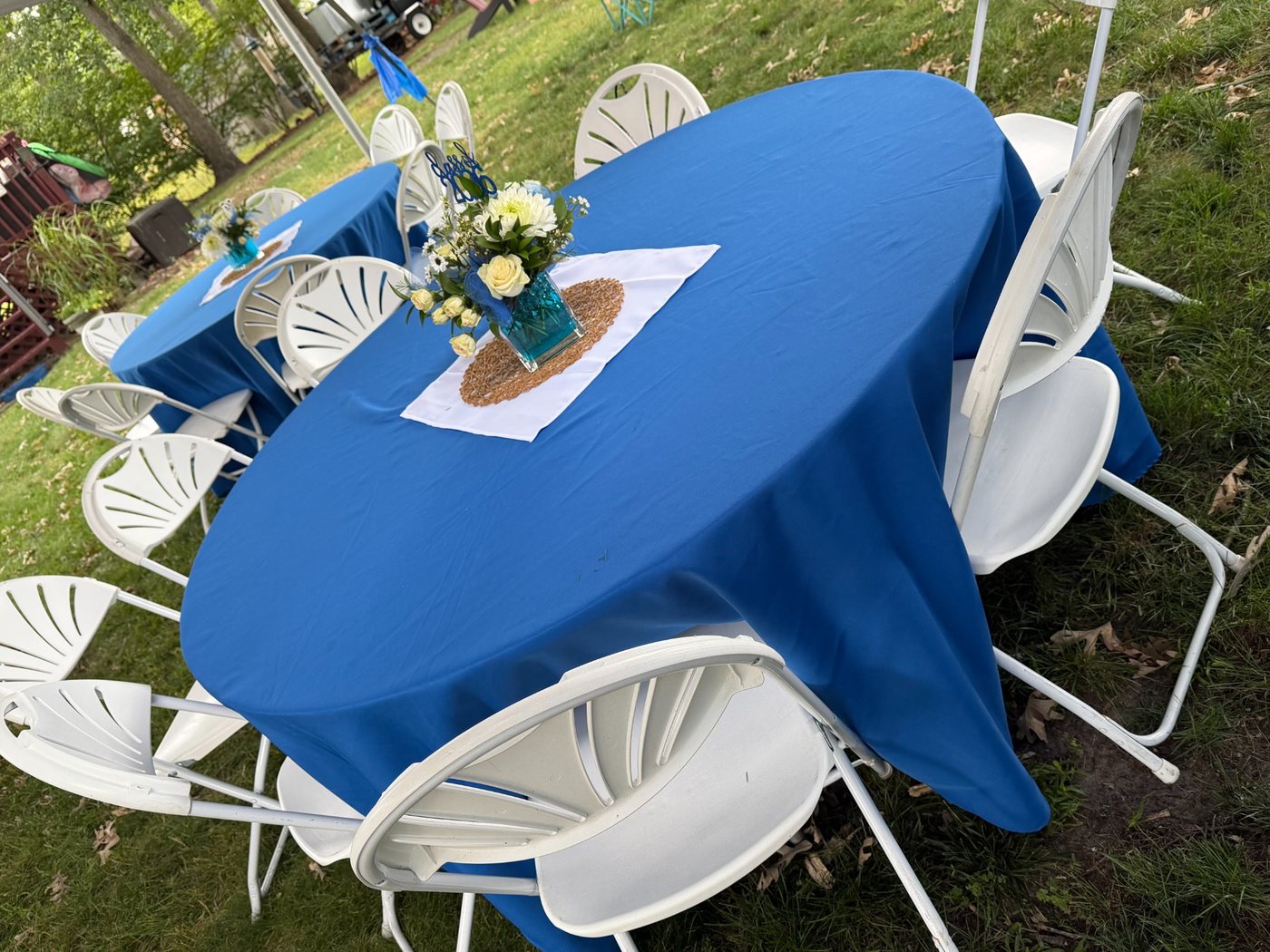 Blue table linens and graduation centerpieces